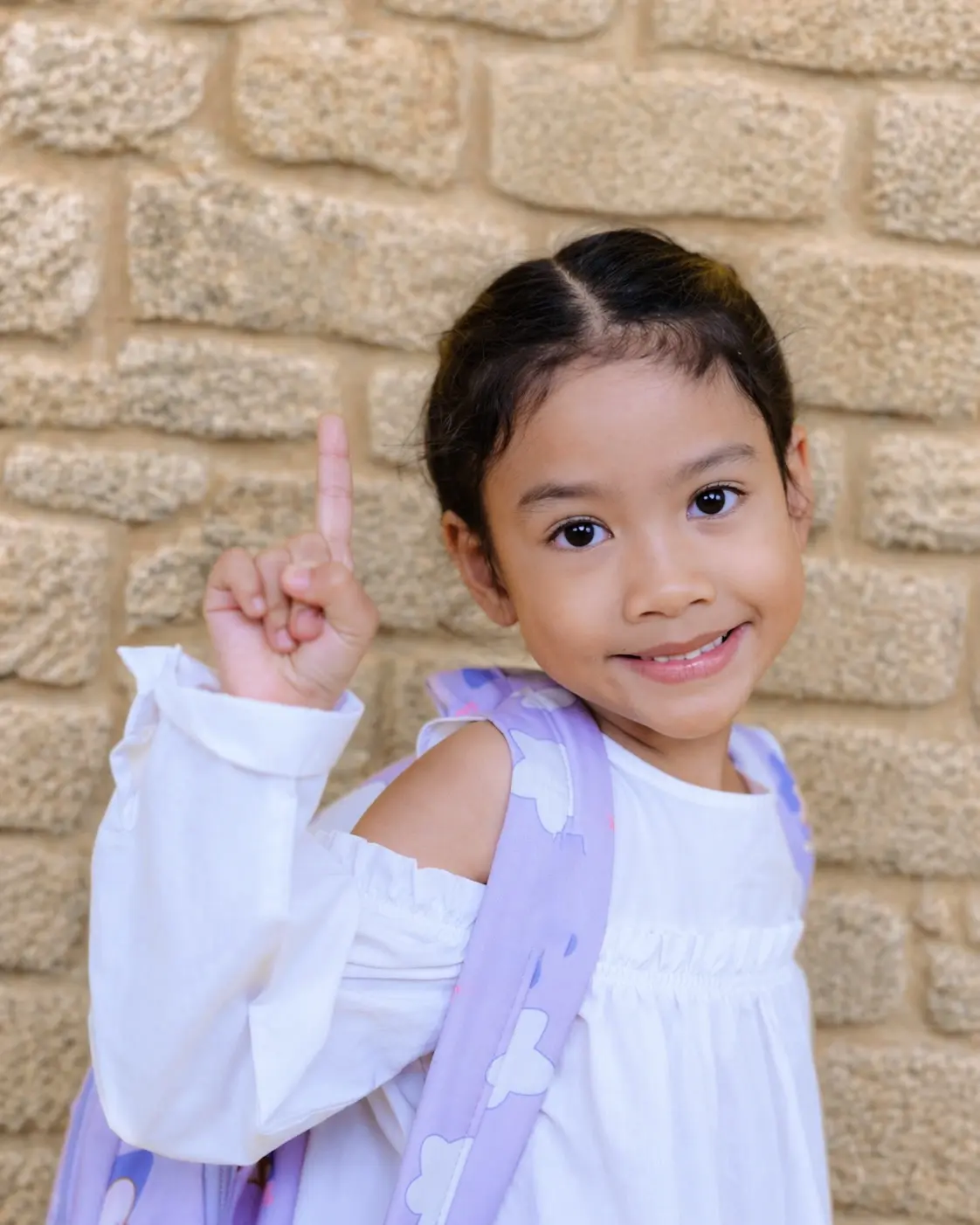 Child receiving heated air lice treatment