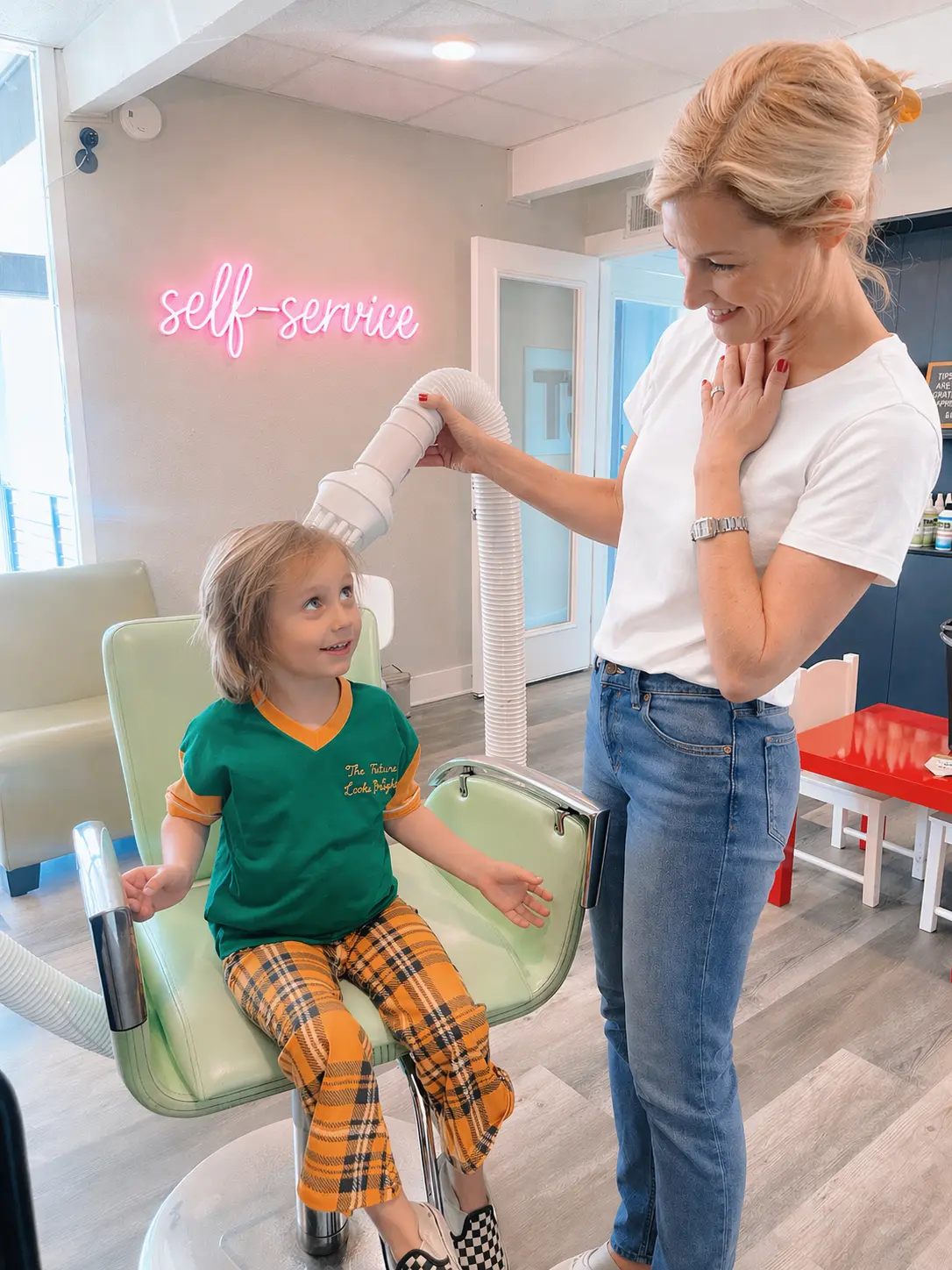 Self-service lice treatment at Lice Clinics of Texas: in-clinic station with professional tools and tablet-guided steps